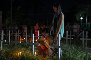 Man-cries-at-mass-grave